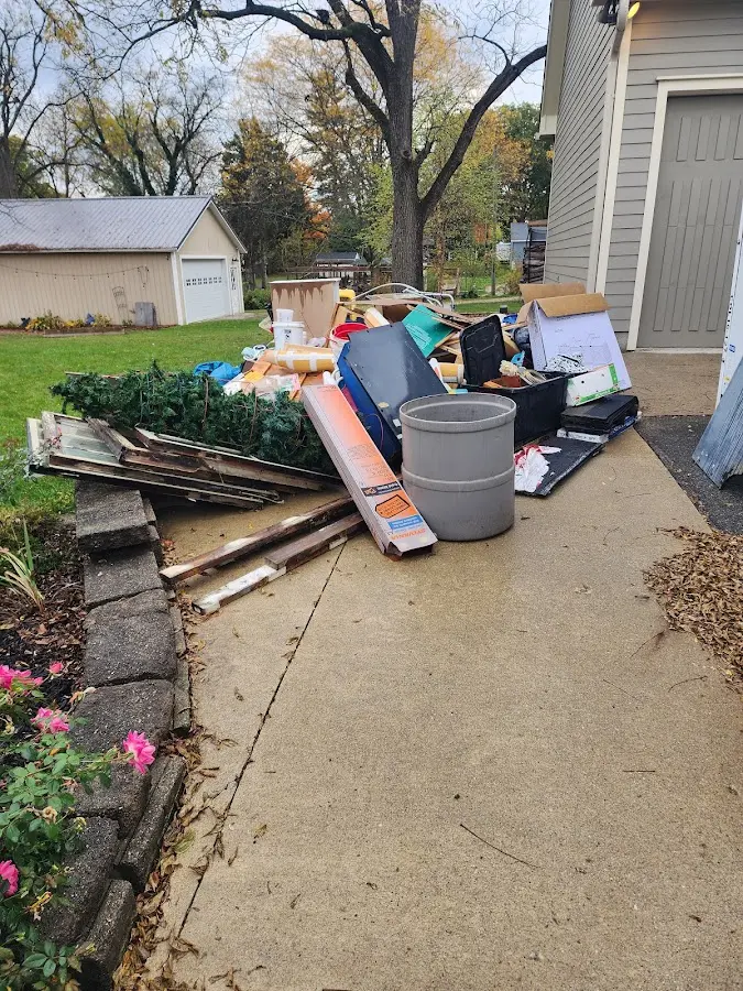 Dumpster being loaded with debris for 3 Yard Dumpster Rental in Carrboro